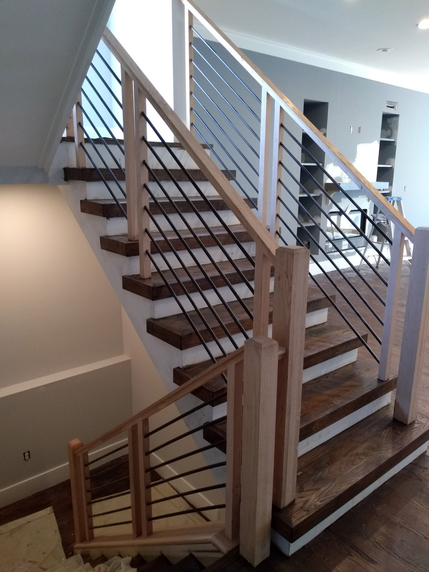 This showcases a completed loudoun stairs project within a home in northern virginia. This showcases the rails that they handmade. 