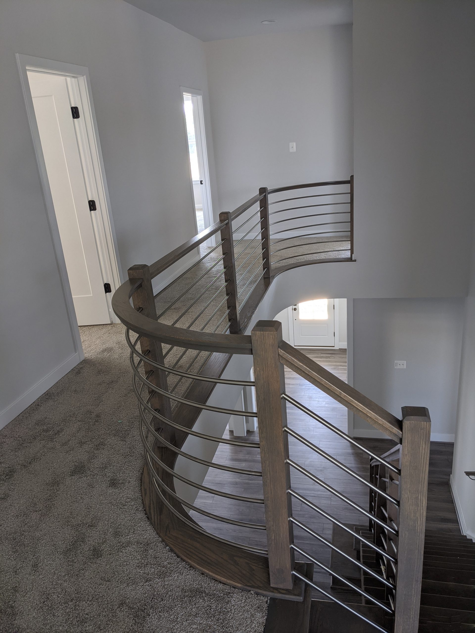 This showcases a completed loudoun stairs project within a home in northern virginia. This showcases the rails that they handmade. 