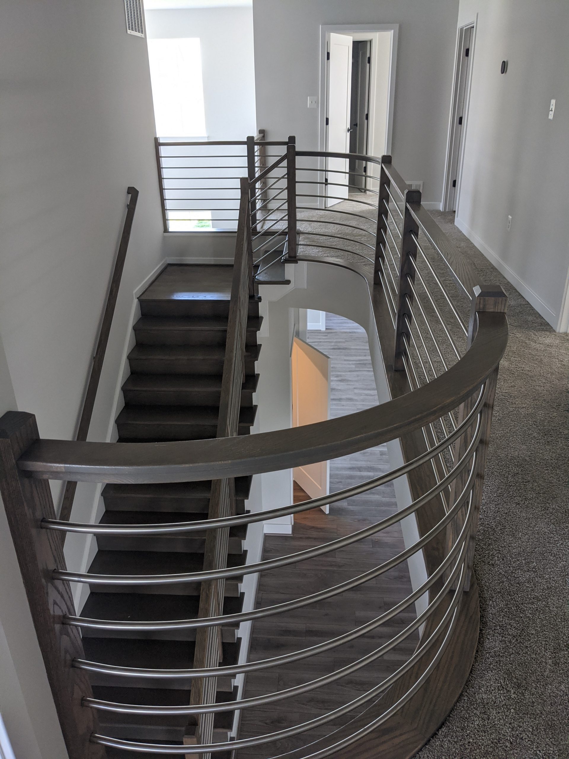 This showcases a completed loudoun stairs project within a home in northern virginia. This showcases the rails that they handmade. 