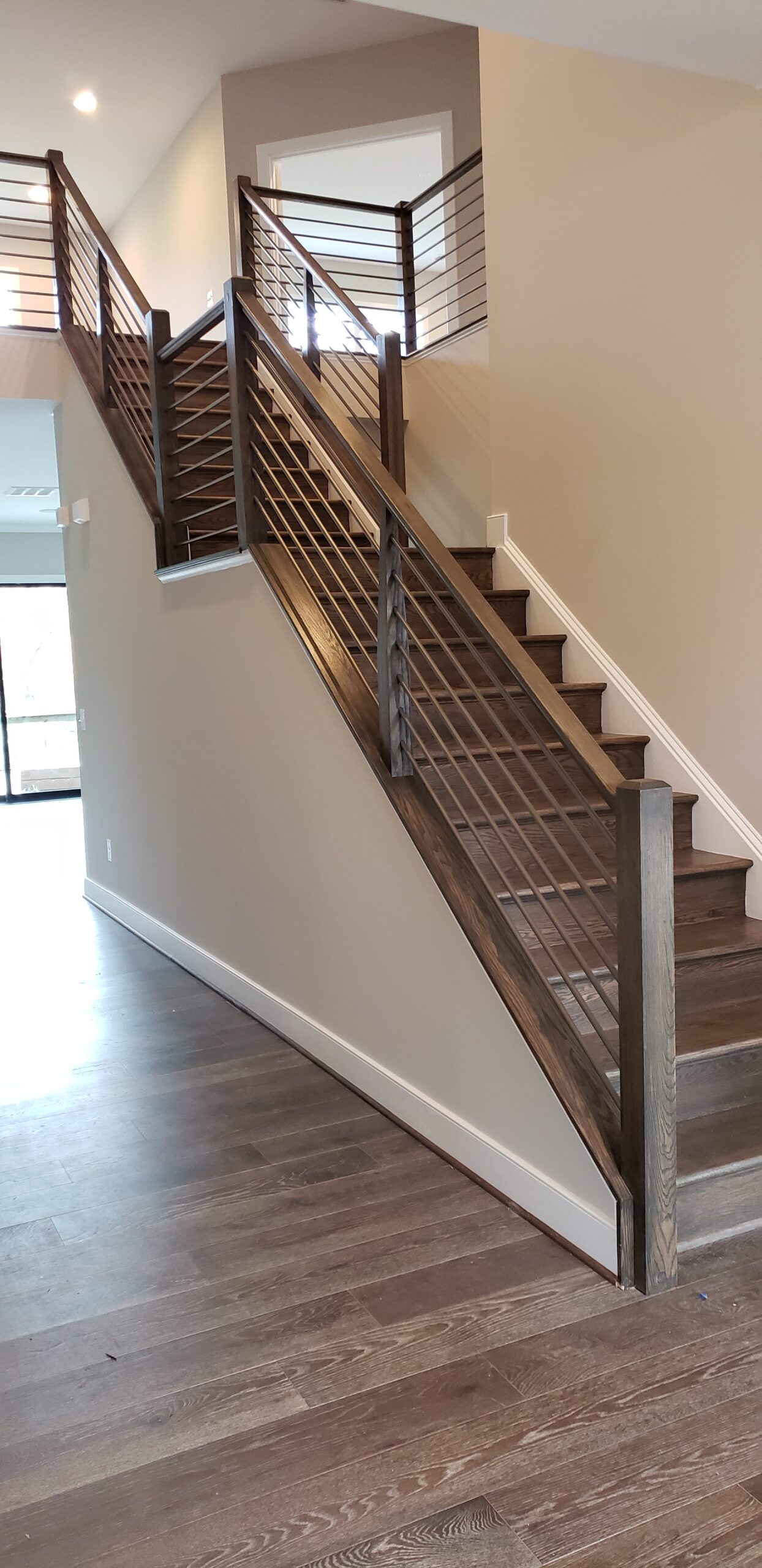 This showcases a completed loudoun stairs project within a home in northern virginia. This showcases the rails that they handmade. 